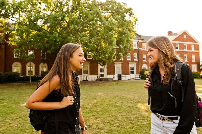 00031cassiewrightphoto Two female students talking on campus